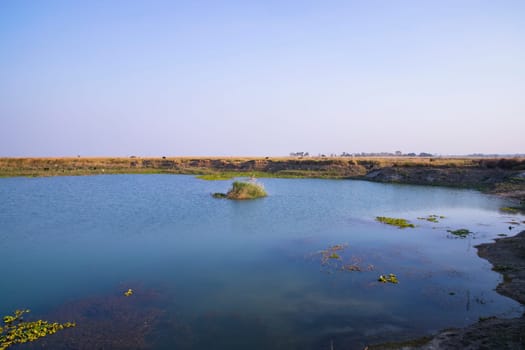 Crystal clear blue water lake landscape view nearby Padma river in Bangladesh