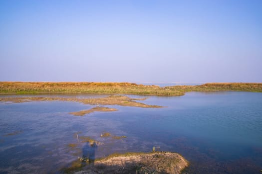 Crystal clear blue water lake landscape view nearby Padma river in Bangladesh
