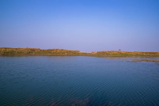 Crystal clear blue water lake landscape view nearby Padma river in Bangladesh