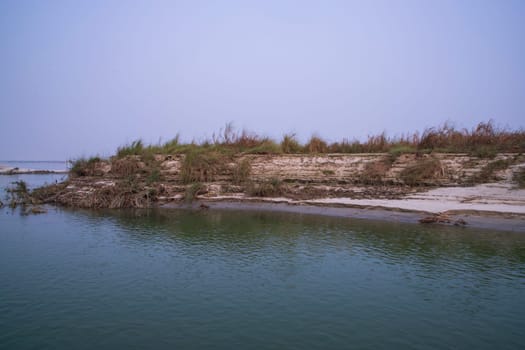 Natural Landscape view Coast of the Padma river with sand dunes and grass
