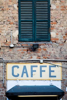 Old vintage coffee sign in Italy - Concept of retro, traditional Caffè design