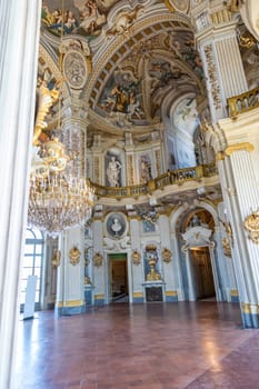 Italy, Stupinigi - January 2023: luxury interior of Royal Palace with baroque marbles and windows