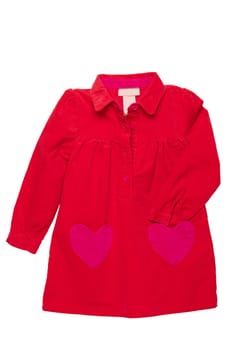 Summer dress isolated. A beautiful red girl's dress with attached heart shaped pockets and long sleeves isolated on white. Kids spring and autumn fashion.