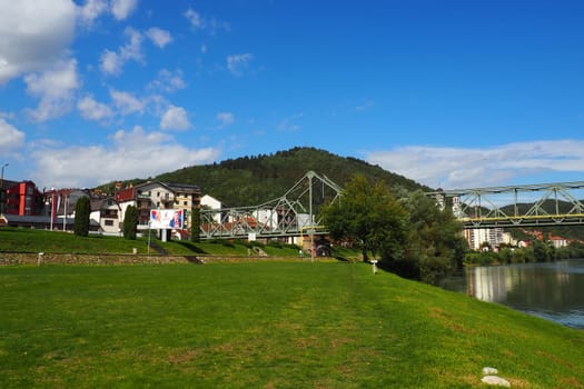 Zvornik, Bosnia and Herzegovina, Mali Zvornik, Serbia, September 29 2022 Drina river. Metal bridge across the Drina. Border point. View of coasts Serbia and BiH. The flow of water, residential houses