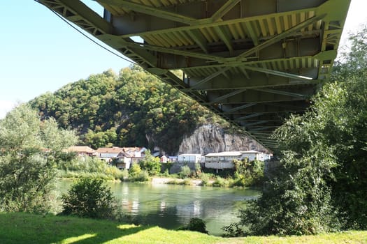 Zvornik, Bosnia and Herzegovina, Mali Zvornik, Serbia, September 29 2022 Drina river. Metal bridge across the Drina. Border point. View of coasts Serbia and BiH. The flow of water, residential houses