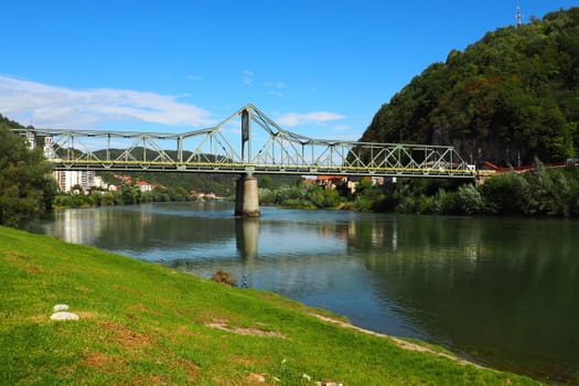 Zvornik, Bosnia and Herzegovina, Mali Zvornik, Serbia, September 29 2022 Drina river. Metal bridge across the Drina. Border point. View of coasts Serbia and BiH. The flow of water, residential houses