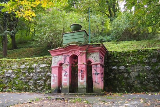 Banja Koviljaca, Serbia, Guchevo, Loznica, September 30, 2022. Rehabilitation center with sulfur and iron mineral waters. Spring with mineral natural water -Three sources. A scribbled pedestal
