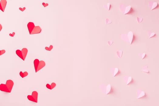 Valentines' day background. Pattern beautiful red and pink paper hearts cut composition greeting gift card isolated on pink background with copy space, Symbol of love Top View from above