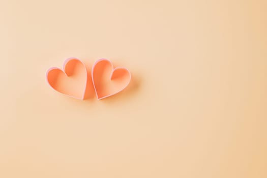 Top view flat lay pink ribbon heart shaped decorative symbol on pastel background, love romance concept, template banner design with copy space, Mother, Women's day, Happy Valentines Day