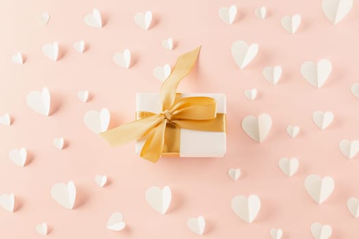 Happy Valentine Day Background. Flat lay beautiful paper hearts and gift box on pastel pink background surprise your loved with copy space, mother's day, concept banner holiday, Valentines day concept