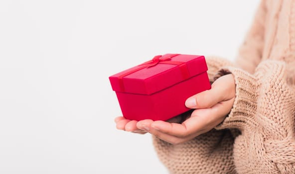 Valentine Day. Woman beauty hands holding small gift package box present wrapped paper with ribbon, Christmas, New year, Birthday holiday background concept