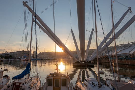 Genoa, Italy - 06 06 2021: View of the old port of Genoa at sunset with boats and Bigo, Italy.