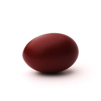 One Easter egg painted with onion peel, isolated on white background