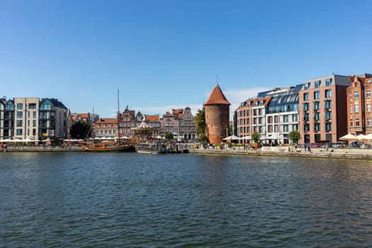 Gdansk, Poland - Sept 9, 2020: The architecture of the old Gdańsk at the Fish Market / Targ Rybny/ on the Motława riverbank