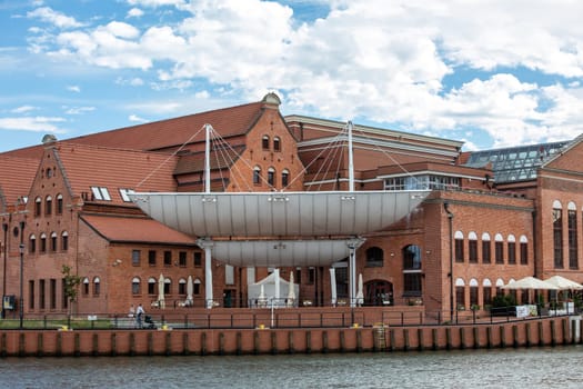Gdansk, Poland - Sept 9, 2020: Polish Baltic F. Chopin Philharmonic in Gdańsk is a concert hall located on Olowianka island on the Motlawa river.