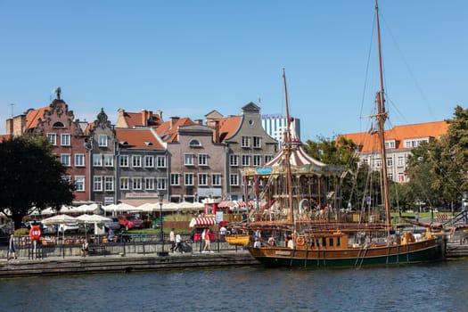 Gdansk, Poland - Sept 9, 2020: The architecture of the old Gdańsk at the Fish Market / Targ Rybny/ on the Motława riverbank
