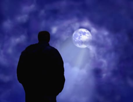 A man deep in thought looking at the moon.