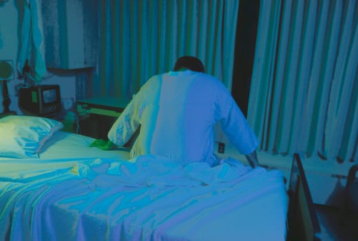 Patient in hospital bed.