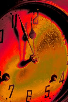 An old antique clock shows the eleventh hour just before midnight.