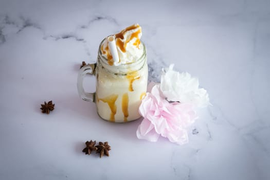 Vanilla  fresh Smootie on a marble table ready to be eat
