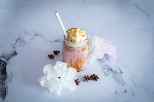 strawberry fresh Smootie on a marble table ready to be eat