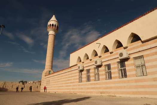 Kids playing in front of Haj Hamdi Mosque Alanis in As-Salt, Salt, Jordan 2021
