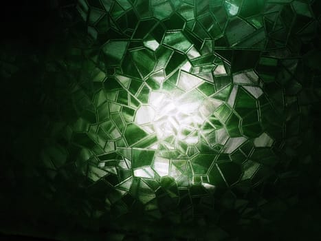 abstract image of corrugated glass on a light and dark background with light reflections. Corrugated glass, black and green image. Abstract pattern on the surface of a window. Protective opaque film