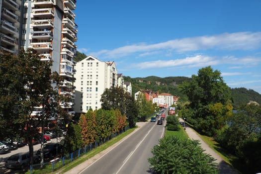 Zvornik, Bosnia and Herzegovina, October 1, 2022, the embankment and streets of the city of Zvornik along the Drina river, the border with Serbia. Multi-storey residential buildings, cars and people