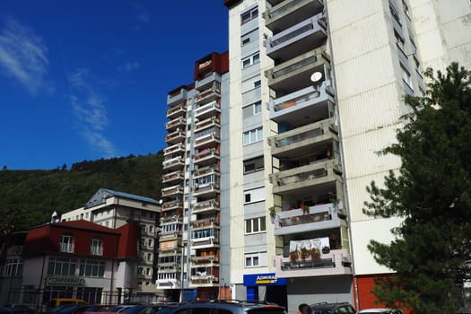 Zvornik, Bosnia and Herzegovina, October 1, 2022, the embankment and streets of the city of Zvornik along the Drina river, the border with Serbia. Multi-storey residential buildings, cars and people