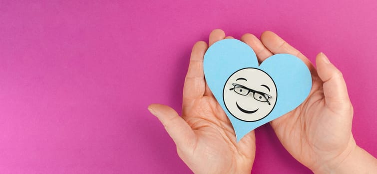 Heart with a smiling face and eyeglasses, mental health concept, positive mindset, support and evaluation symbol