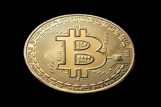 gold coin bitcoin on a black isolated background. High quality photo
