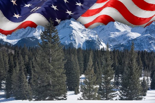 The American flag over the Rocky Mountains, Colorado.