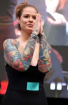 Krakow, Poland - June 12, 2022: Unidentified participant during the contest for the best tattoo at the 15th Tattoofest Convention in Cracow. One of the most prestigious tattoo festivals.