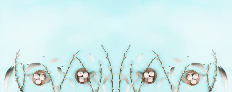 Easter eggs with willow branches and bird feathers, holiday greeting card, spring season background