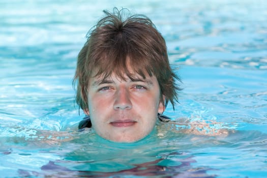man in a swimming pool in summer