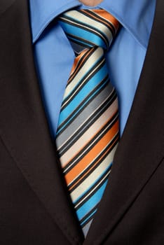 detail of a Business man Suit with colored tie