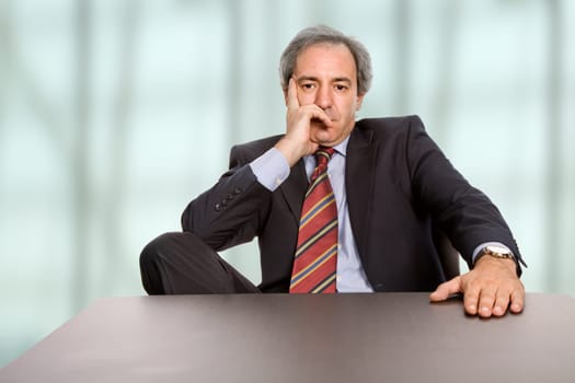 mature business man on a desk at the office