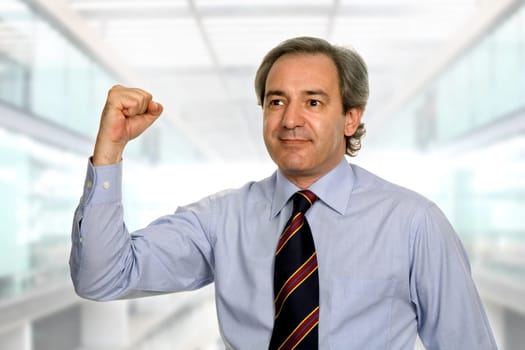 successful business man winning, at the office
