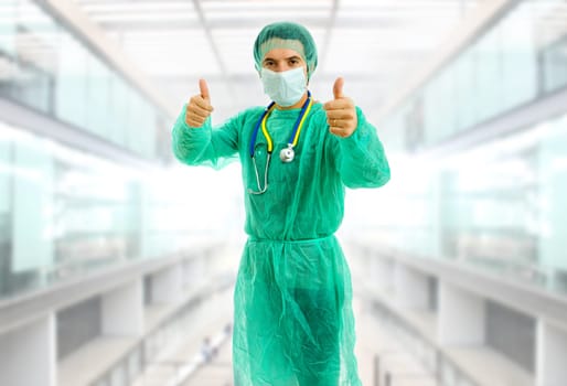 young male doctor going thumbs up at the hospital