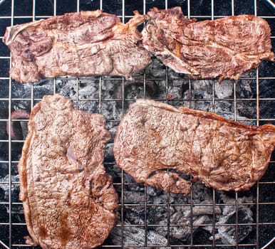 Photograph of some grilled meat juicy steaks