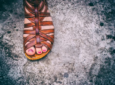Photograph of a womans foot with a sandal