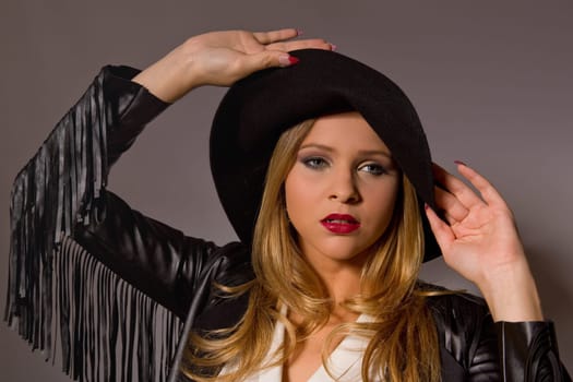 fashion young woman on a grey background