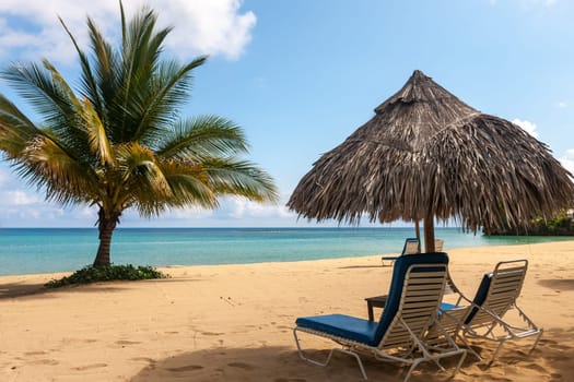 Sunbed and umbrella on a beautiful tropical beach