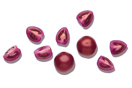 Top view of purple tomatoes isolated on white background