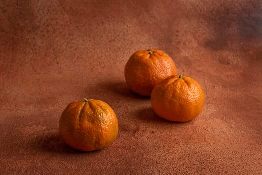 Tangerines on orange background