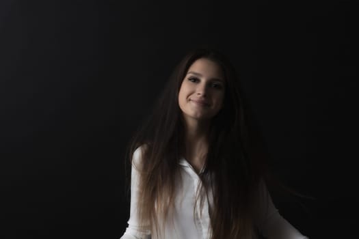 Portrait of smiling long haired girl. Horizontally.