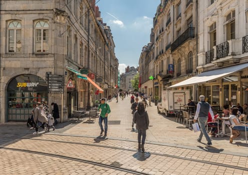 View of unidentified people on a street in Besancon, France