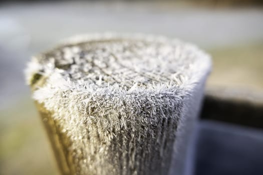Detail of wood outside on a cold winter day, ice and snow