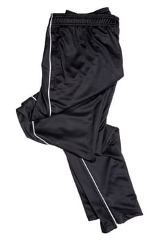 Sweat pants isolated. Closeup of mens fashionable black sweat pants or jersey trousers isolated on a white background. Clipping path. Outfit for workout.