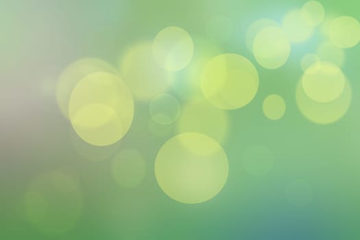 Abstract delicate gradient green light and yellow pastel spring or summer bokeh background. Beautiful texture.